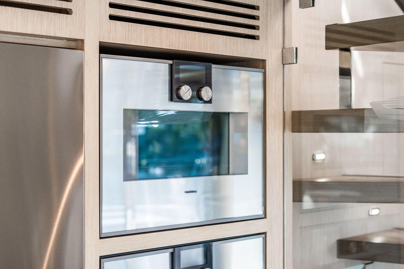 a silver rectangular electronic device aboard PLANE TO SEA Yacht for Sale