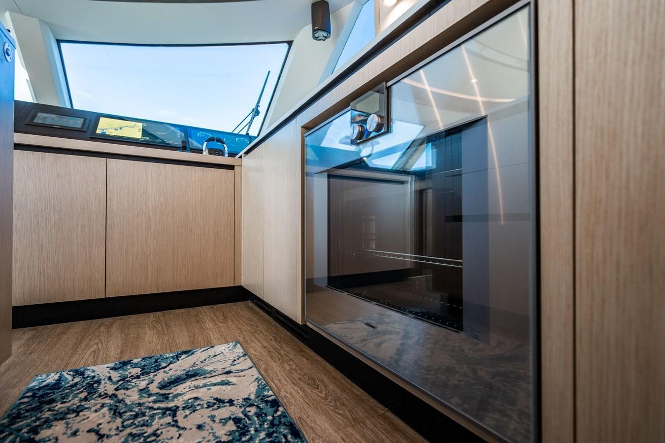 a room with a sliding glass door aboard PLANE TO SEA Yacht for Sale