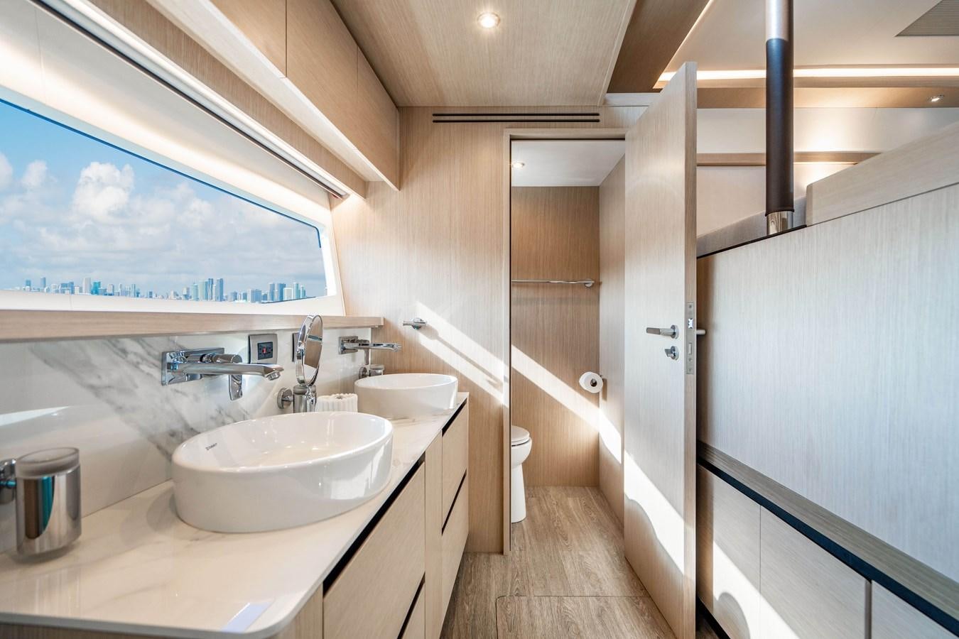 a bathroom with a sink and a shower aboard PLANE TO SEA Yacht for Sale
