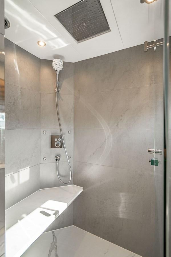 a shower with a shower head aboard PLANE TO SEA Yacht for Sale