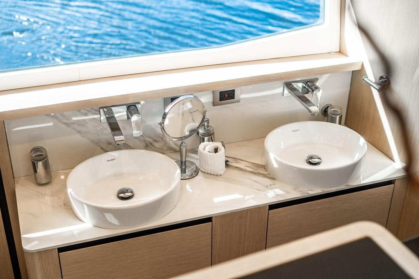 a couple of sinks in a bathroom aboard PLANE TO SEA Yacht for Sale