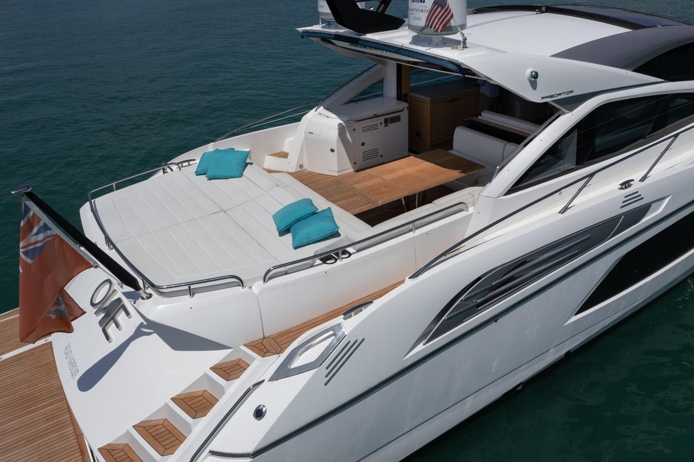 a white boat on a deck aboard SUNSEEKER PREDATOR 68 Yacht for Sale