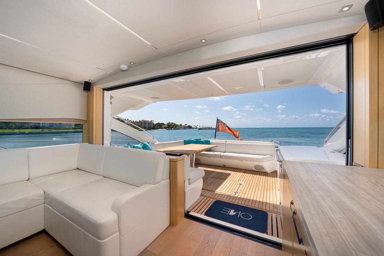 a room with a couch and a pool aboard SUNSEEKER PREDATOR 68 Yacht for Sale