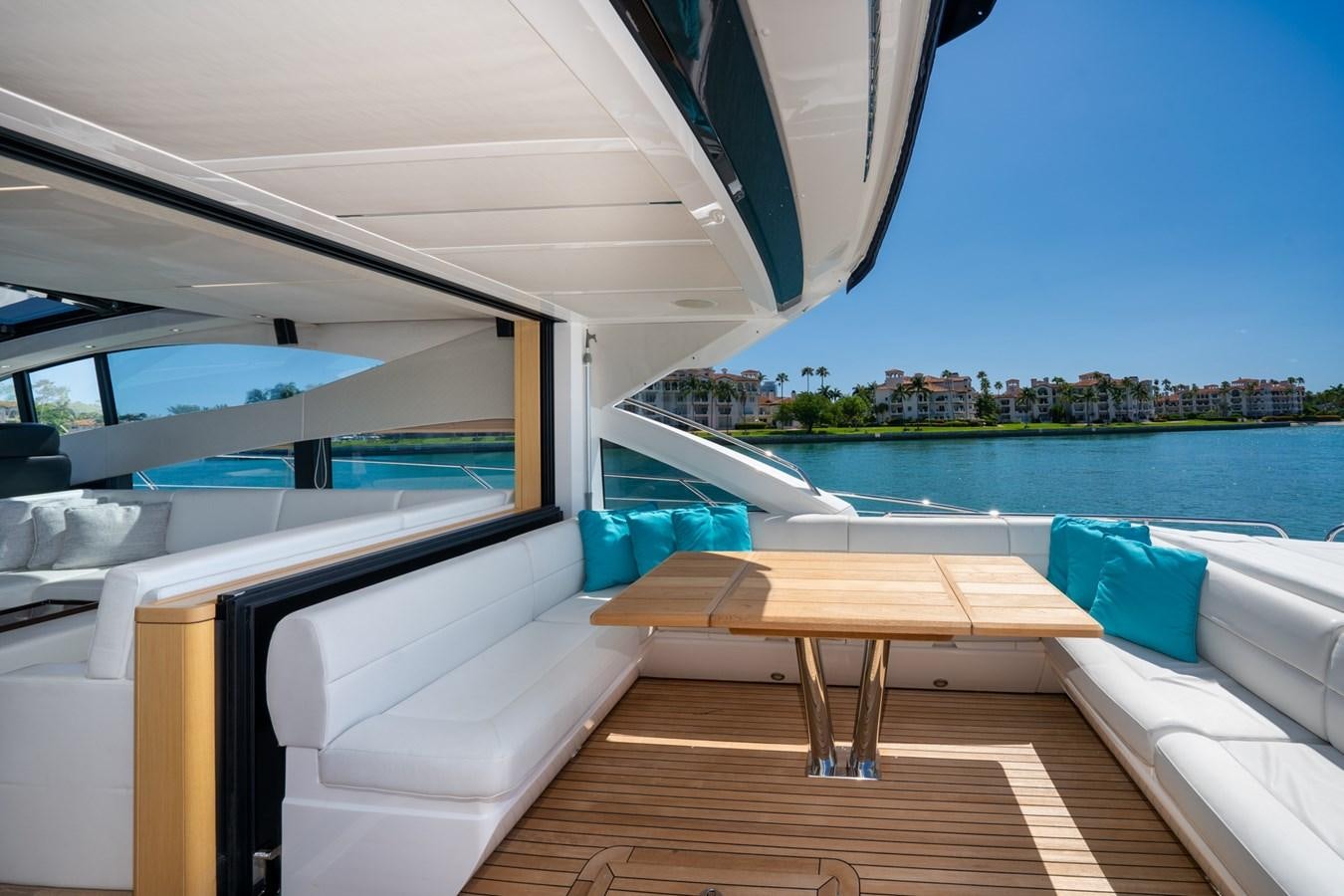 a room with a table and a view of the water aboard SUNSEEKER PREDATOR 68 Yacht for Sale