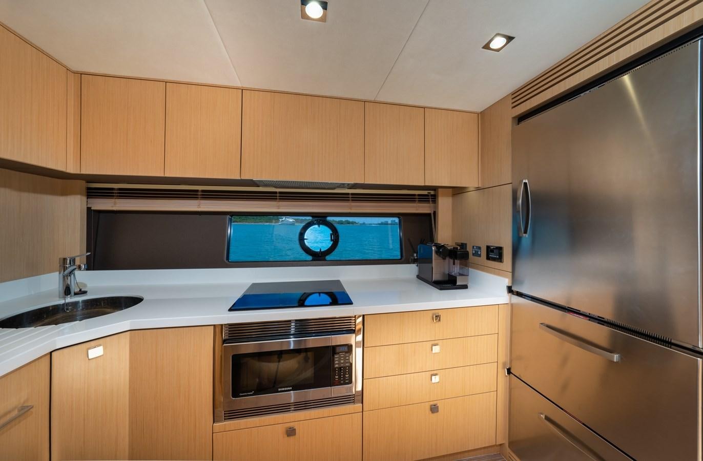 a kitchen with a stove and oven aboard SUNSEEKER PREDATOR 68 Yacht for Sale