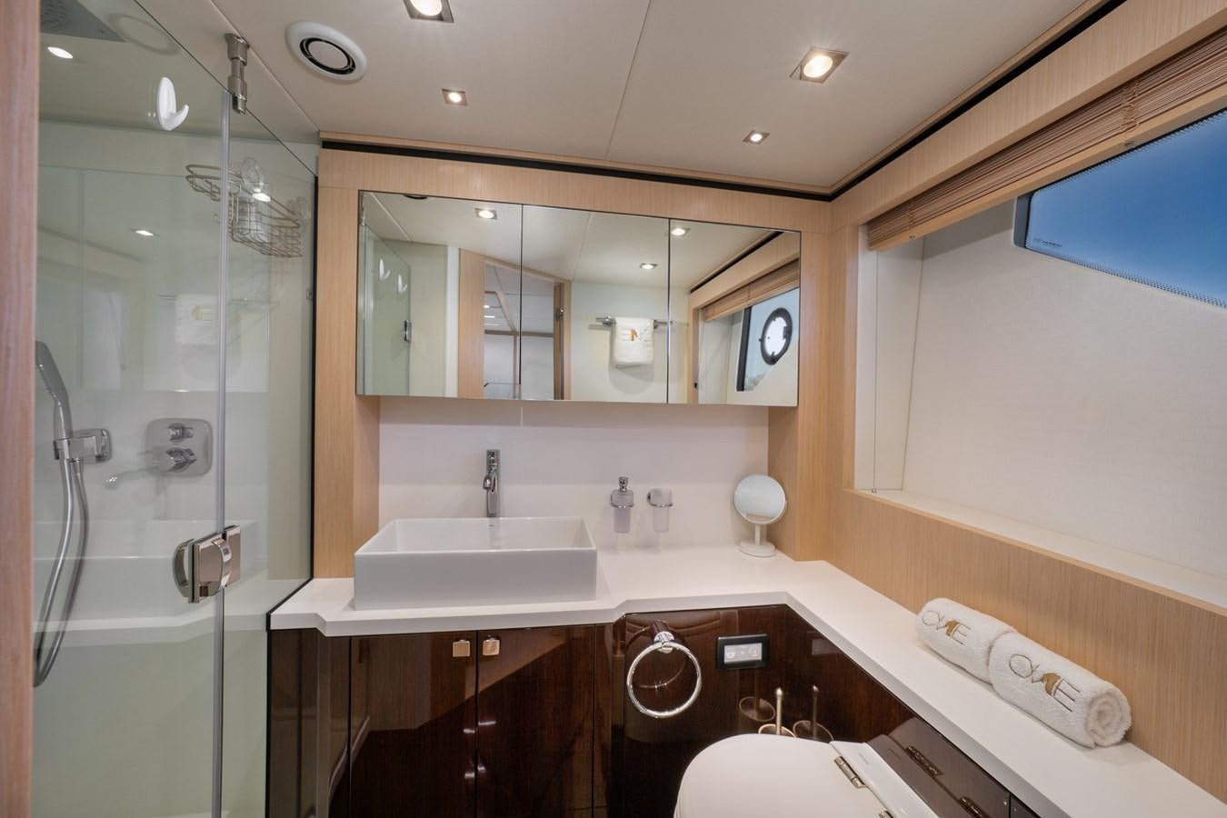 a bathroom with a large mirror aboard SUNSEEKER PREDATOR 68 Yacht for Sale