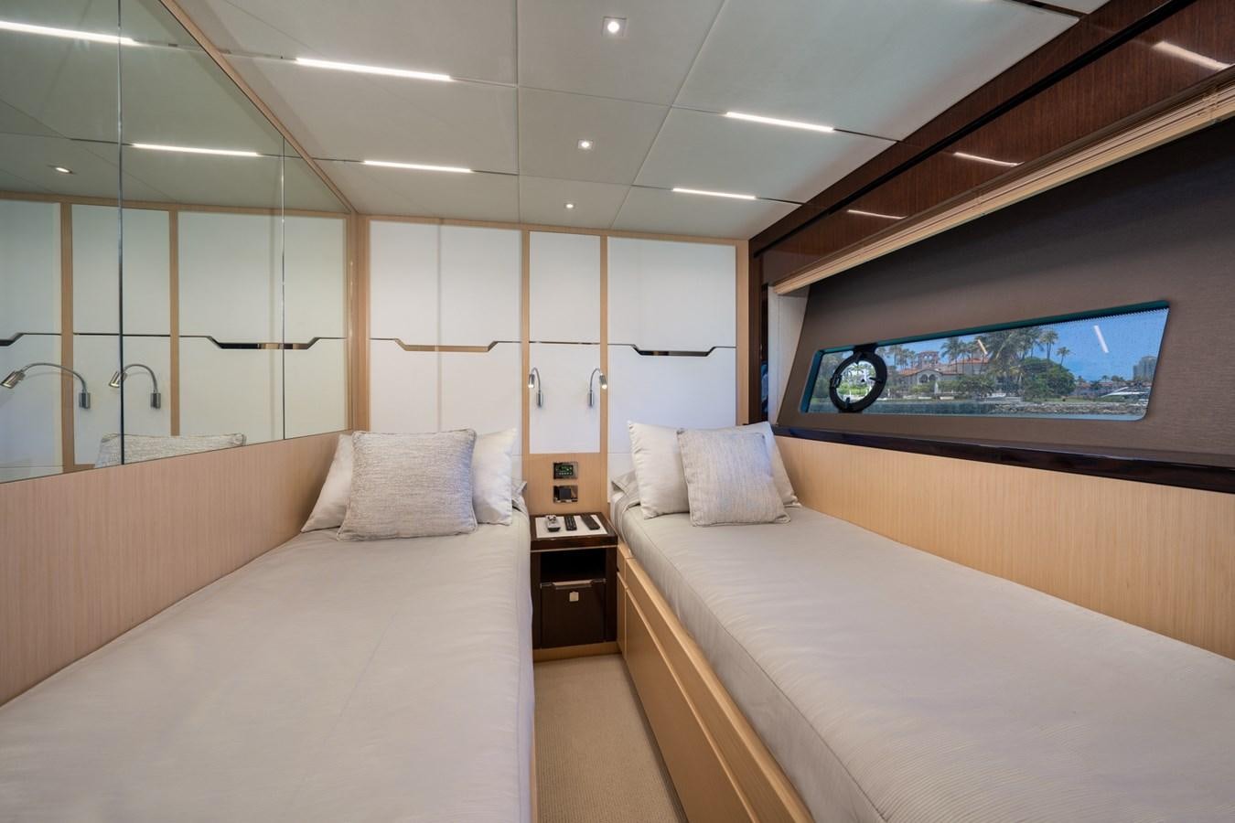 a room with a bed and a tv on the wall aboard SUNSEEKER PREDATOR 68 Yacht for Sale