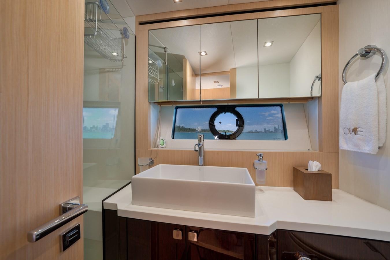 a bathroom with a large mirror aboard SUNSEEKER PREDATOR 68 Yacht for Sale