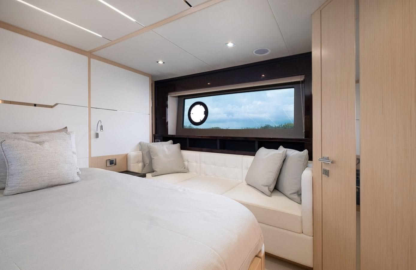 a room with a bed and a television aboard SUNSEEKER PREDATOR 68 Yacht for Sale