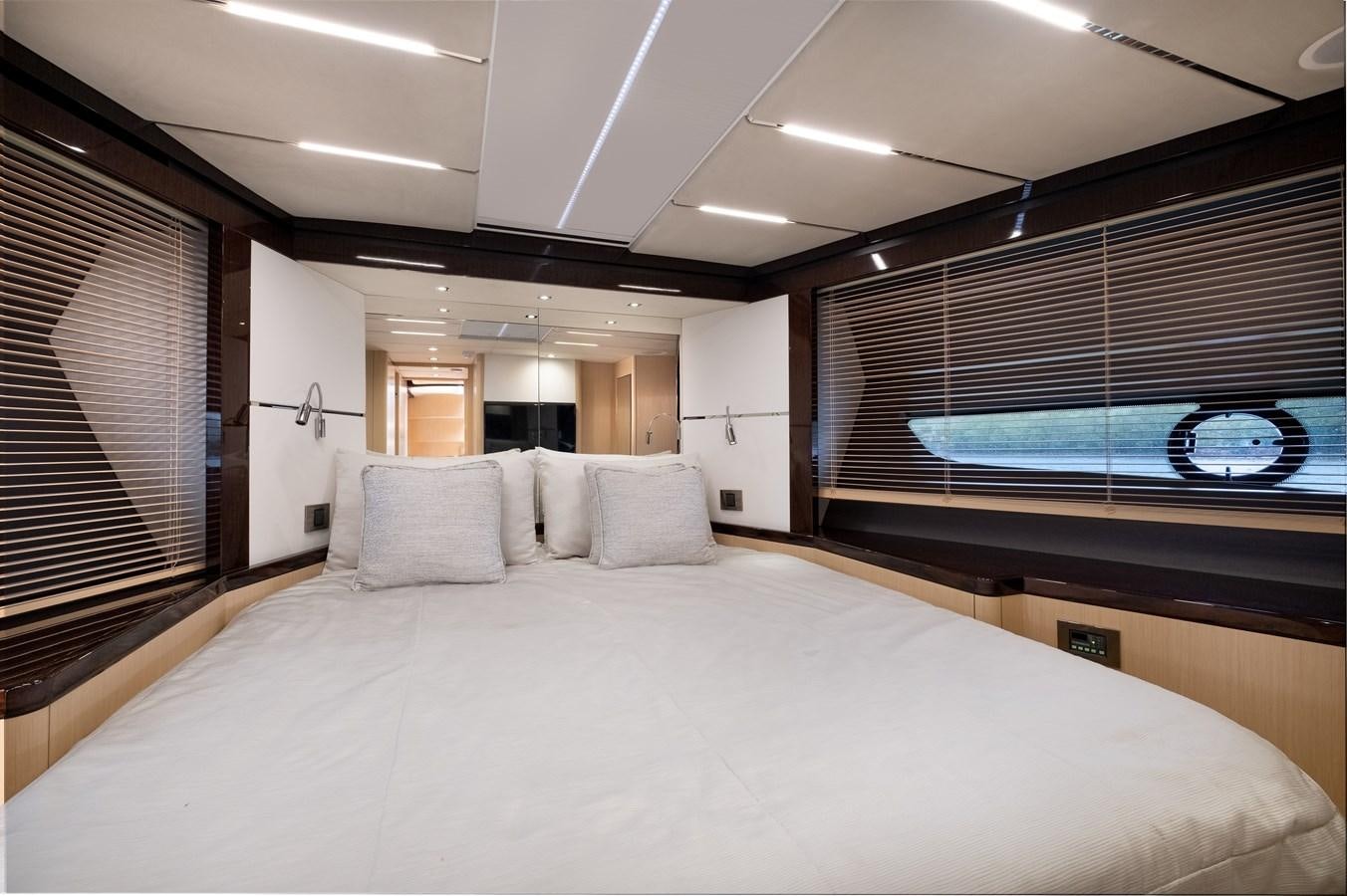 a large bed with a large white bed spread aboard SUNSEEKER PREDATOR 68 Yacht for Sale