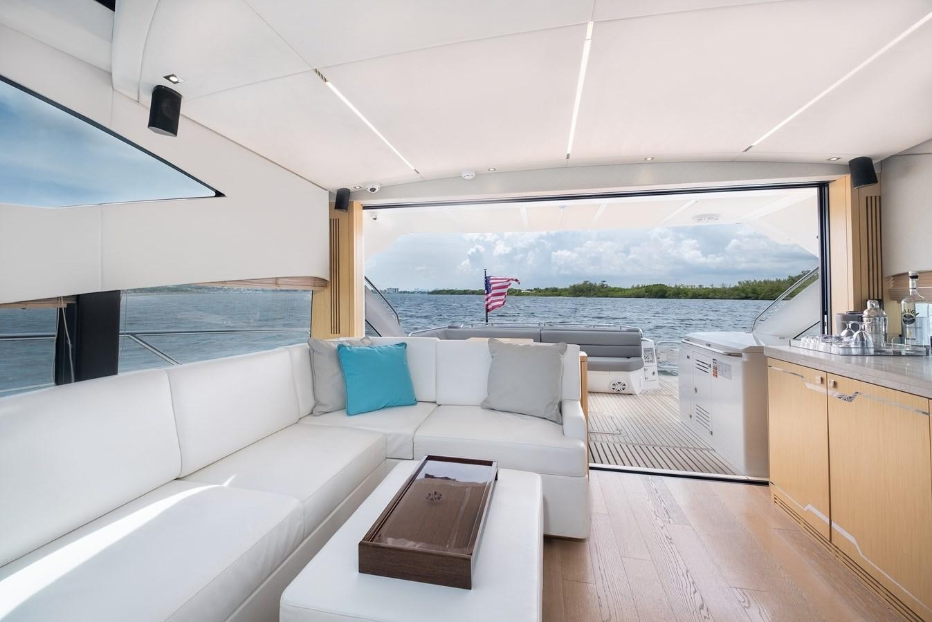 a room with a large window and a view of the ocean aboard SUNSEEKER PREDATOR 68 Yacht for Sale