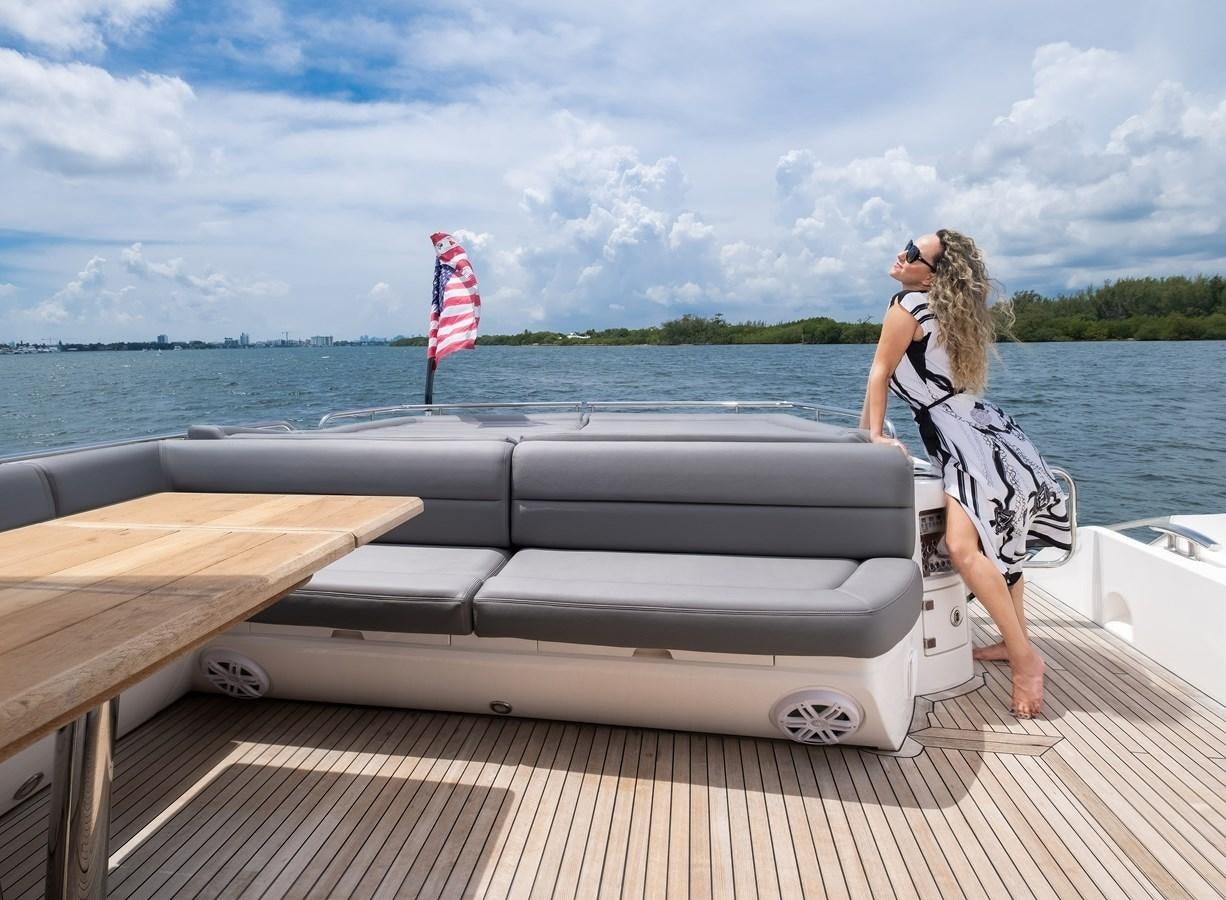 a woman standing on a boat aboard SUNSEEKER PREDATOR 68 Yacht for Sale