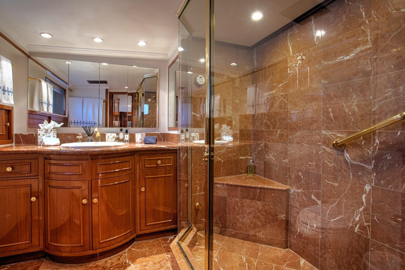 a bathroom with a glass shower aboard MARYBELLE Yacht for Sale