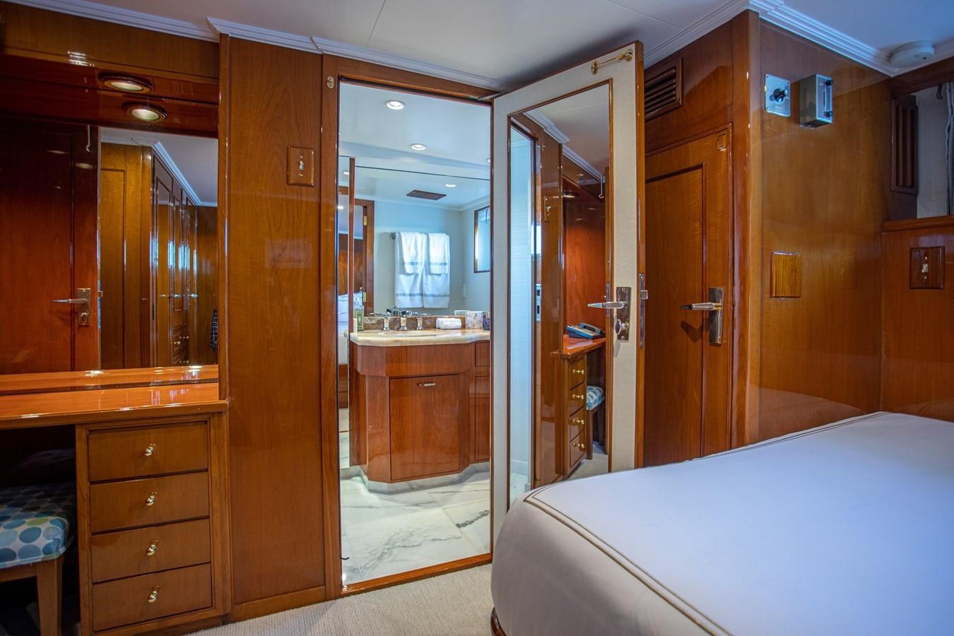 a room with a bed and a closet aboard MARYBELLE Yacht for Sale