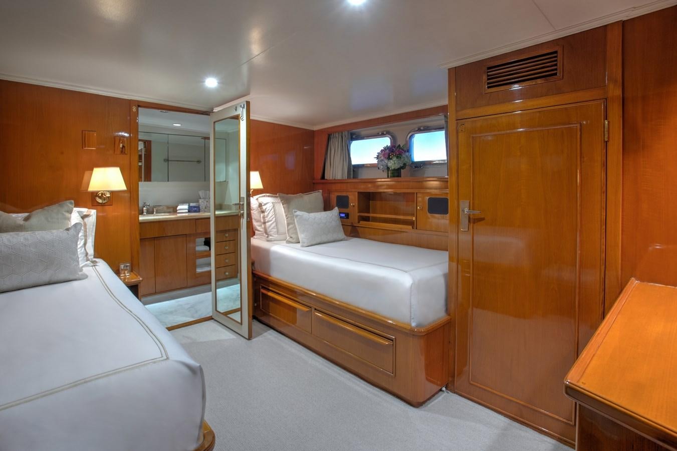 a bedroom with a bed and a closet aboard MARYBELLE Yacht for Sale