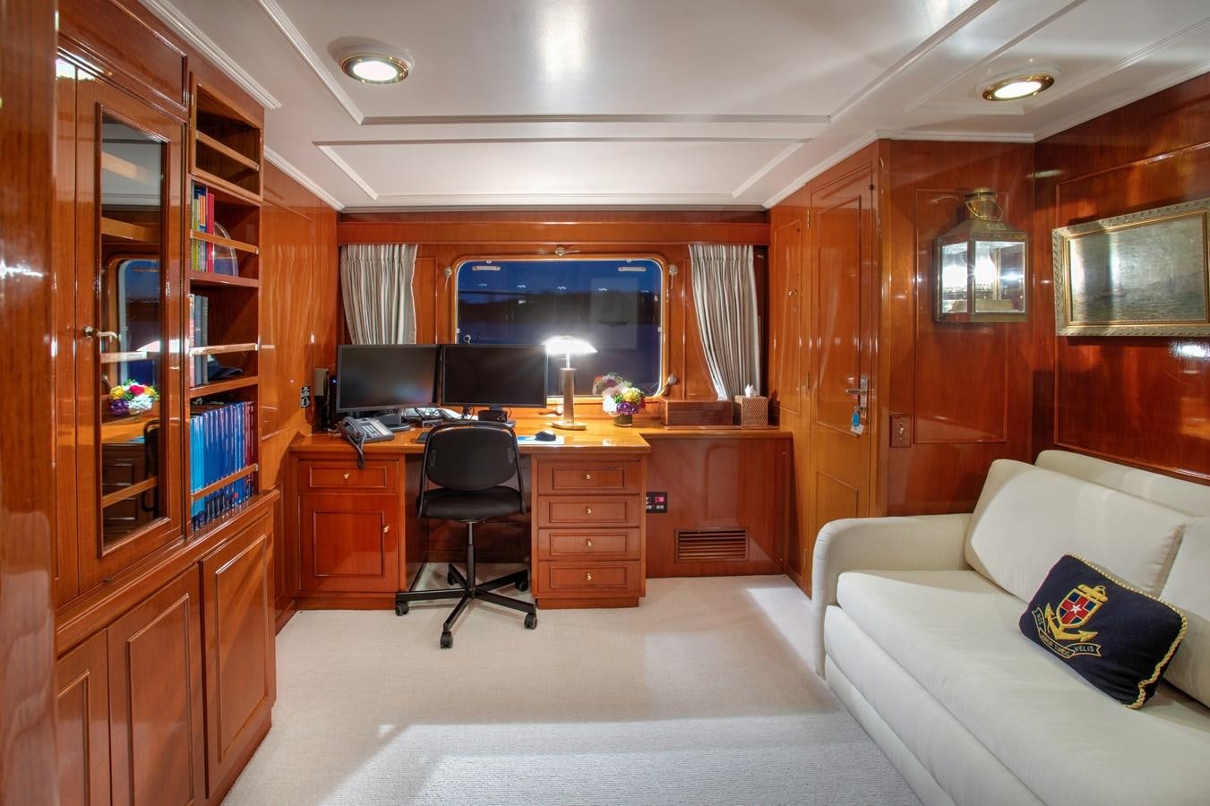 a living room with a couch and a tv aboard MARYBELLE Yacht for Sale