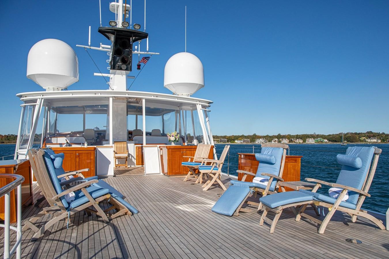 a deck with chairs and a table on it aboard MARYBELLE Yacht for Sale