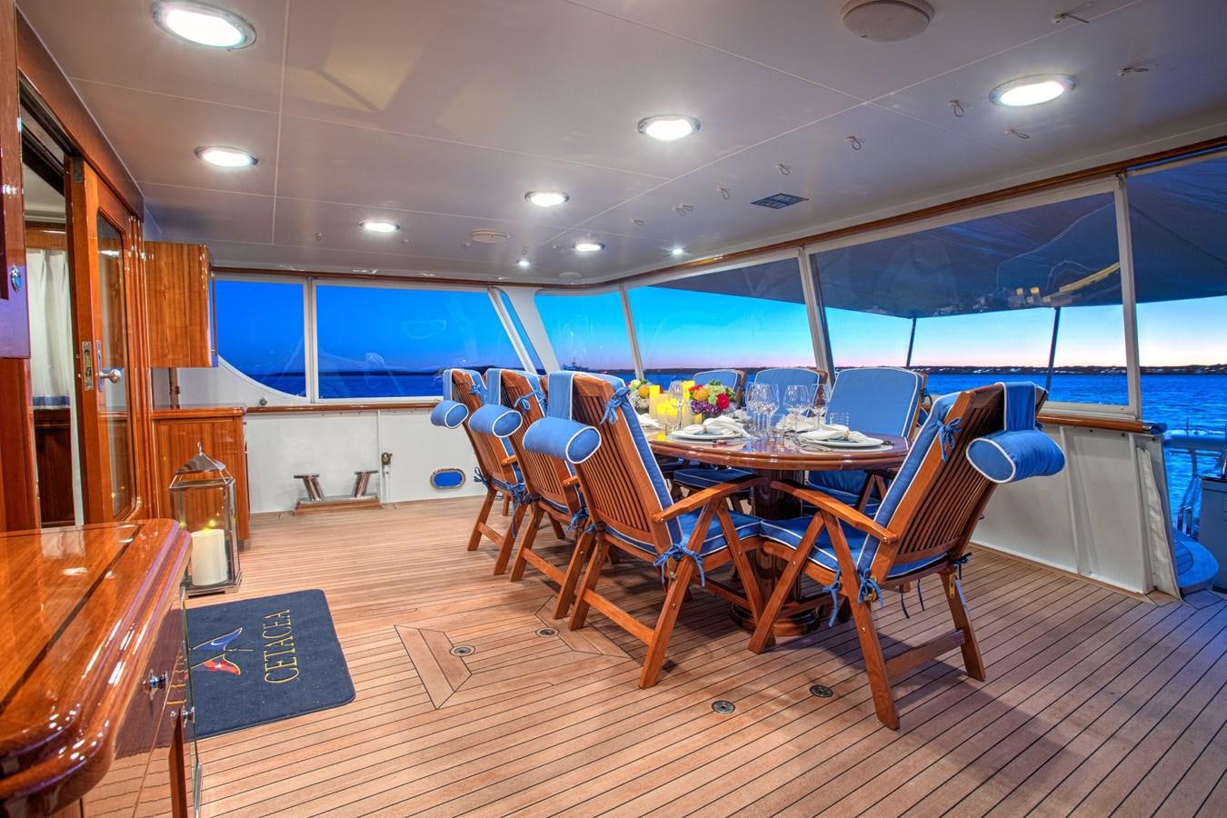a dining room with a wood floor aboard MARYBELLE Yacht for Sale