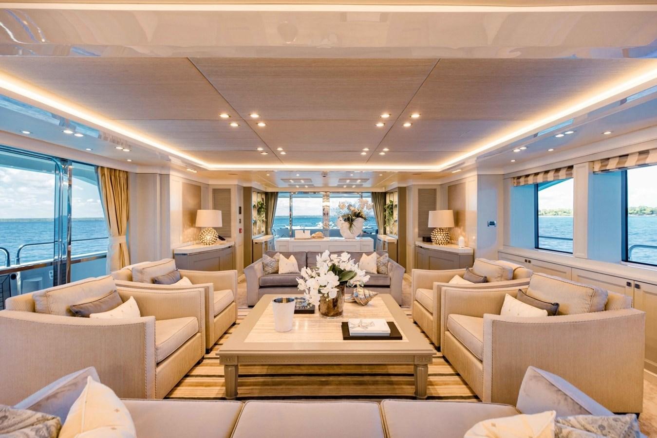 a living room with a large window aboard TAYRONA Yacht for Sale
