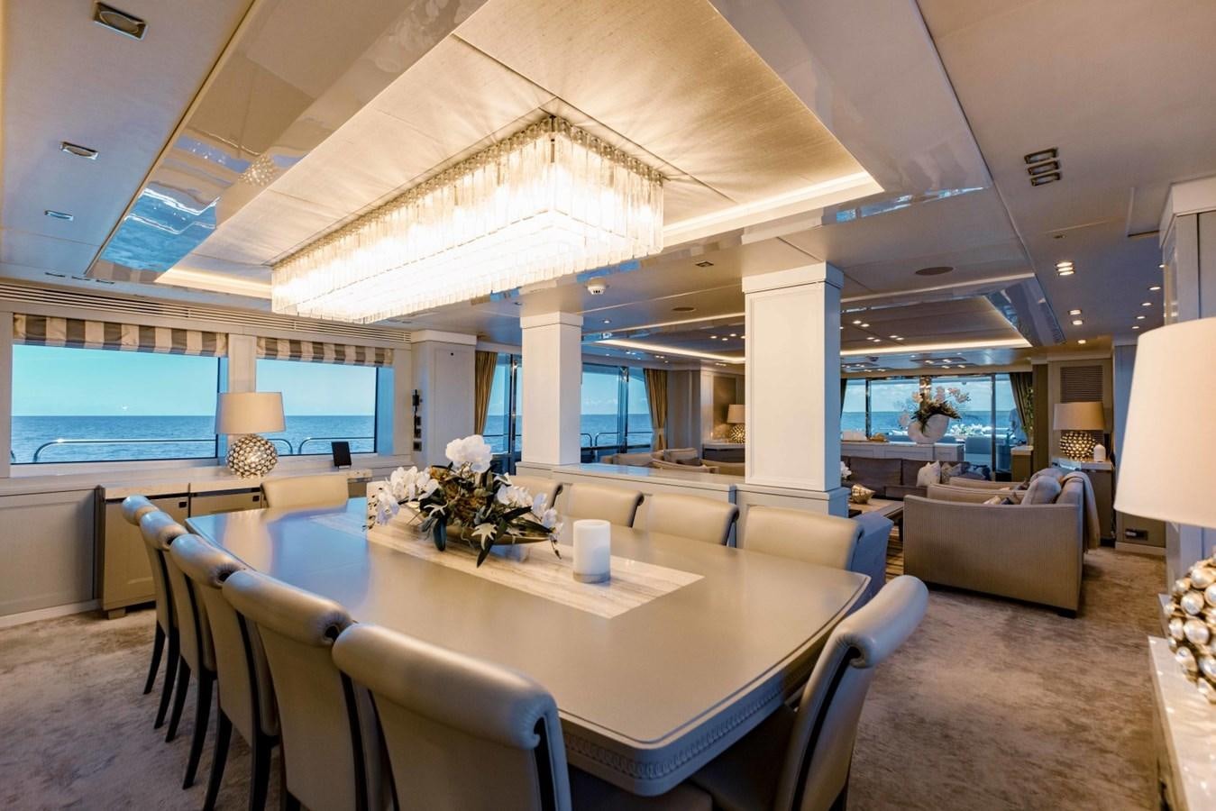 a room with a table and chairs aboard TAYRONA Yacht for Sale
