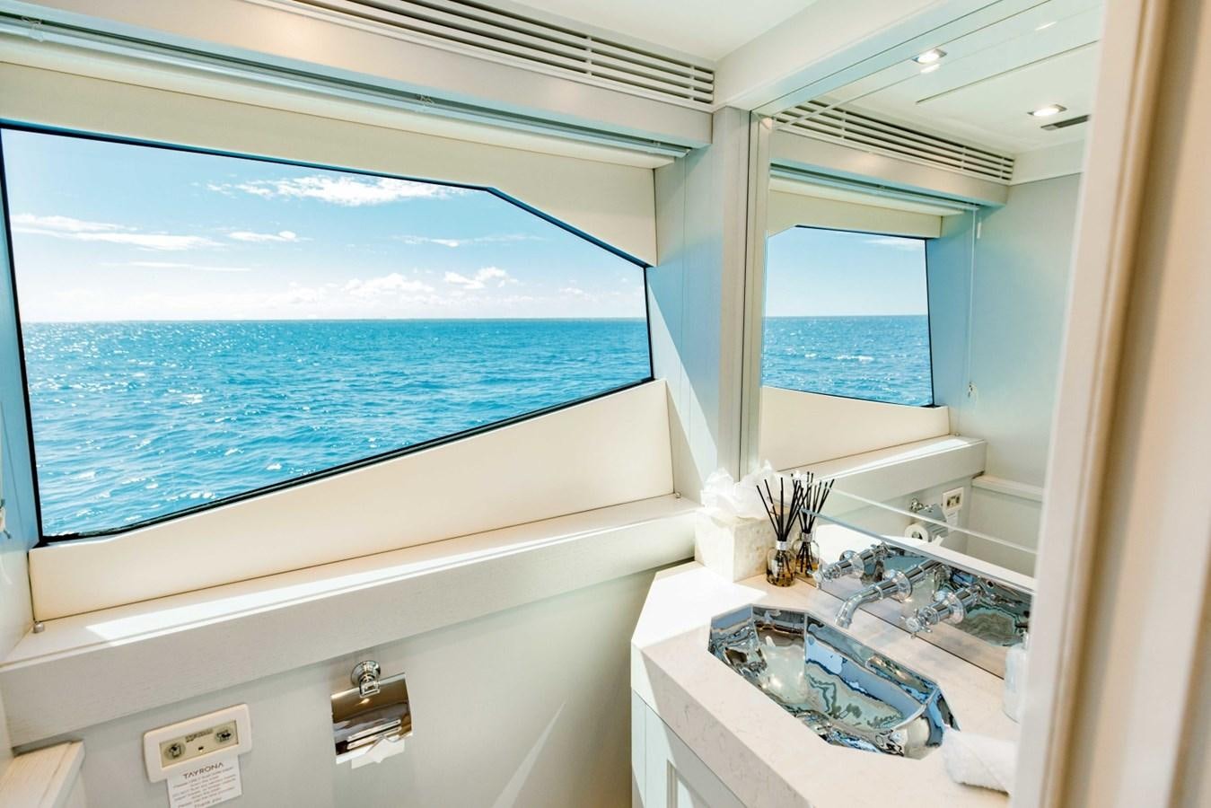 a bathroom with a large window overlooking the ocean aboard TAYRONA Yacht for Sale