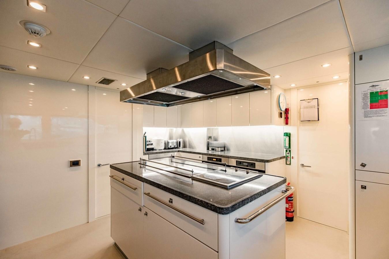 a kitchen with a stove and oven aboard TAYRONA Yacht for Sale