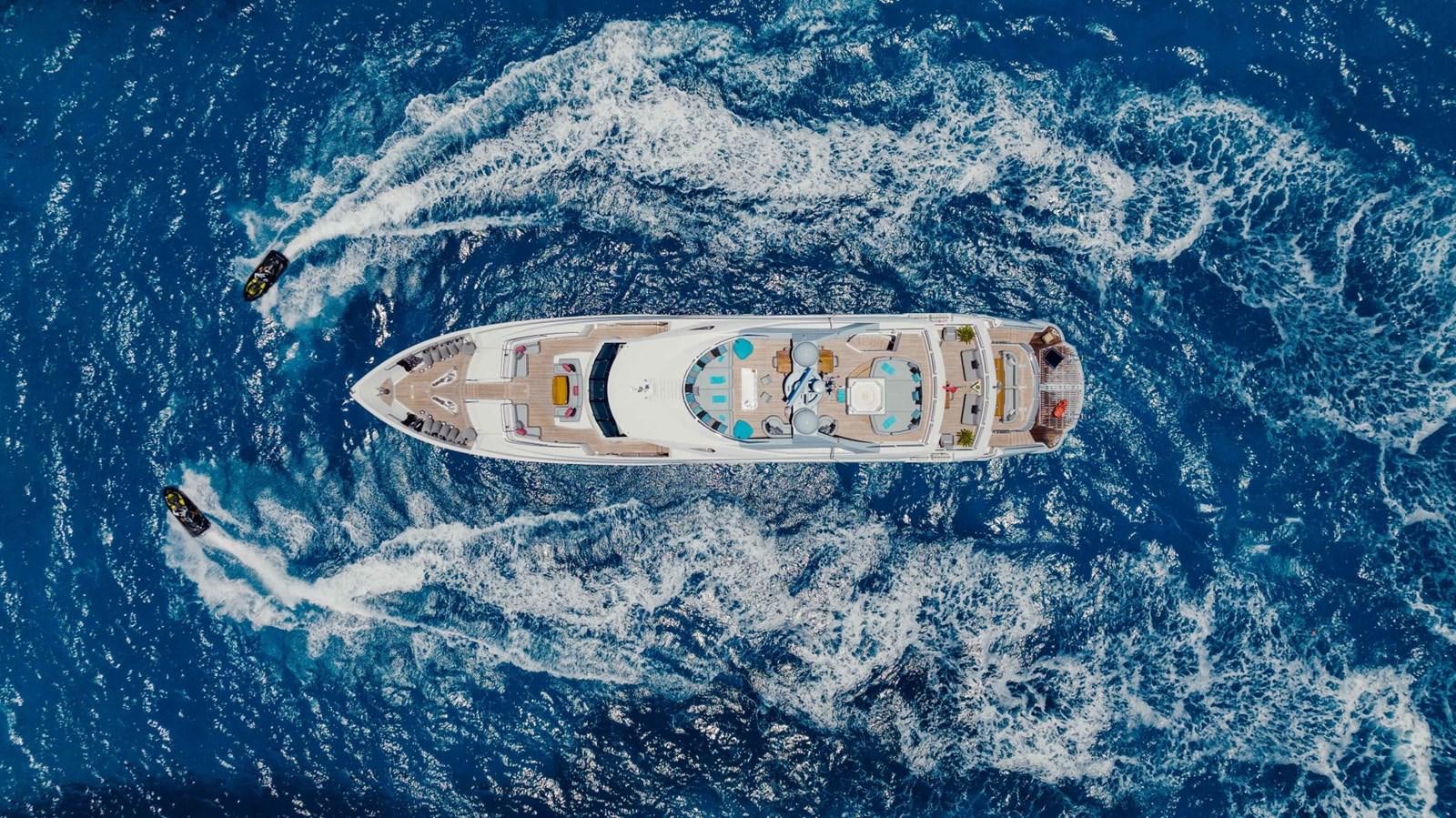 a white and black boat in the water aboard TAYRONA Yacht for Sale