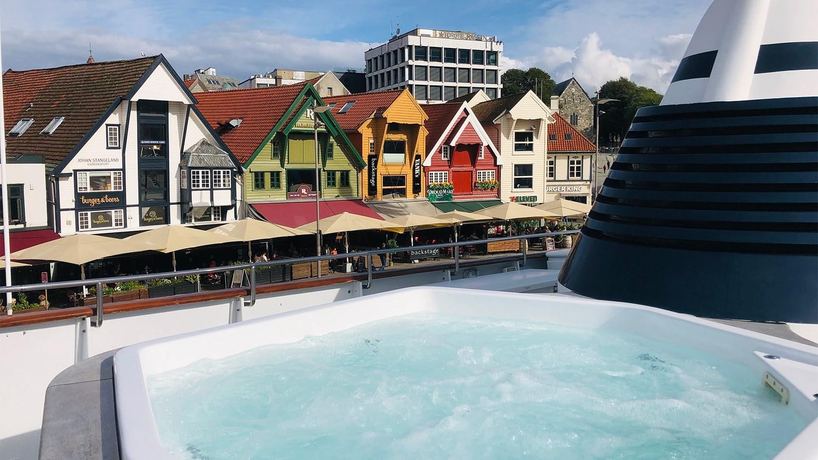 a pool with buildings around it aboard CHANTAL Yacht for Sale