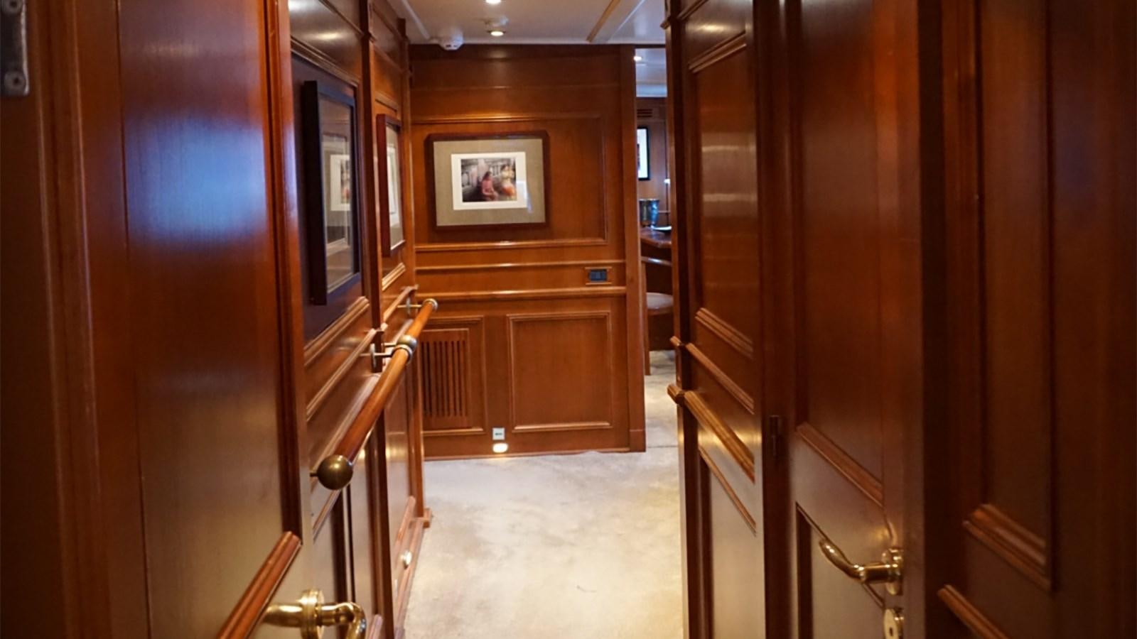 a room with wooden cabinets aboard CHANTAL Yacht for Sale