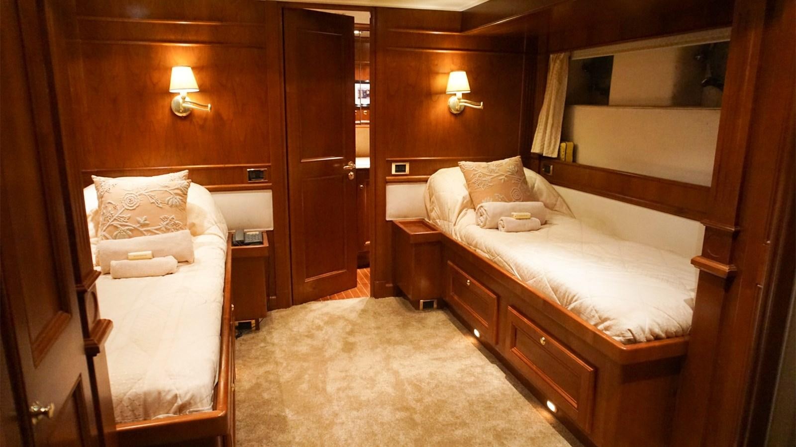 a room with two beds aboard CHANTAL Yacht for Sale