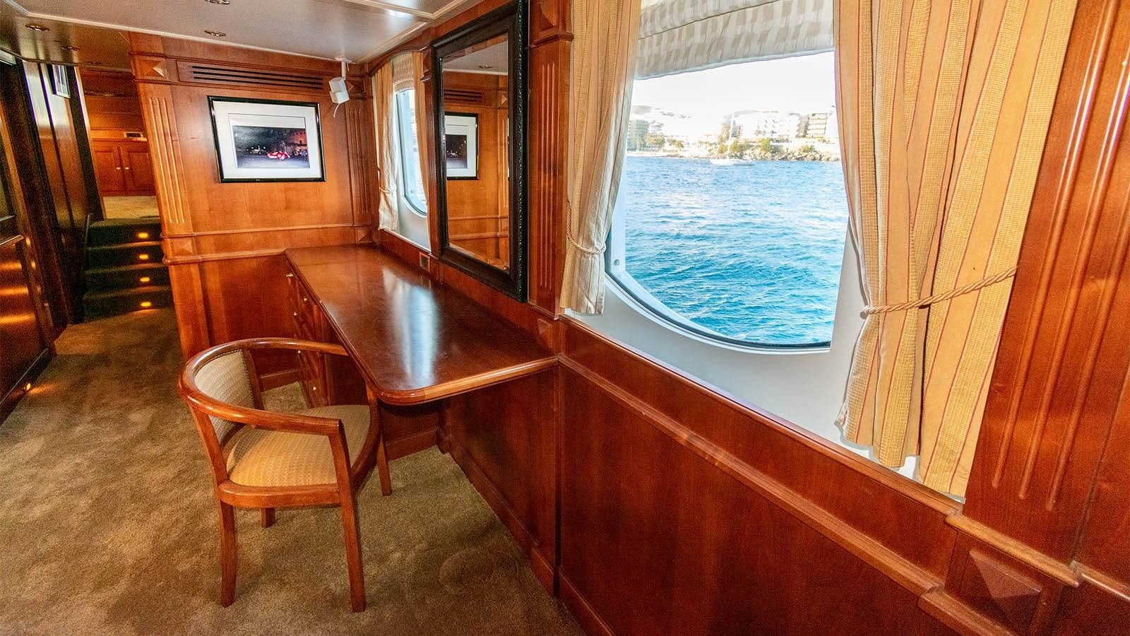 a room with a table and chairs aboard CHANTAL Yacht for Sale