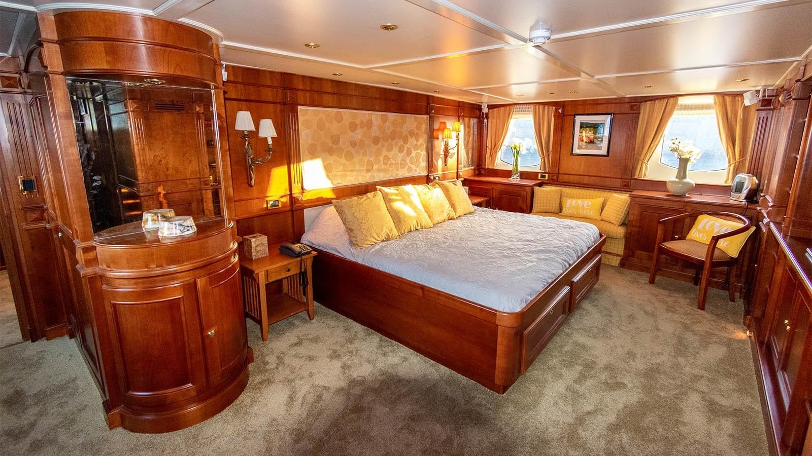 a large bedroom with a bed aboard CHANTAL Yacht for Sale