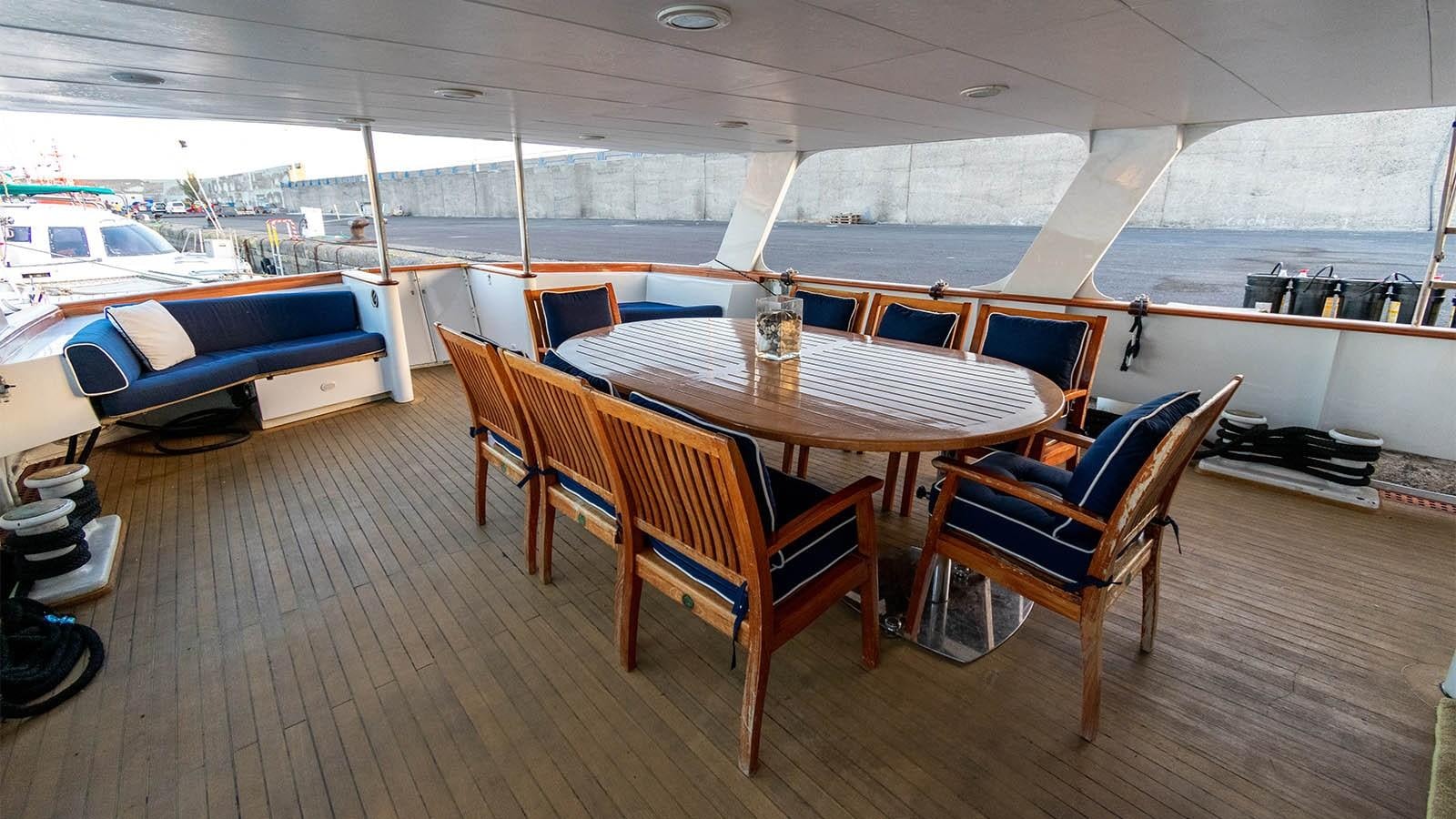 a table and chairs in a room aboard CHANTAL Yacht for Sale