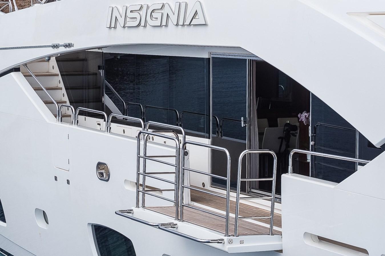 a white boat with a ladder aboard INSIGNIA Yacht for Sale