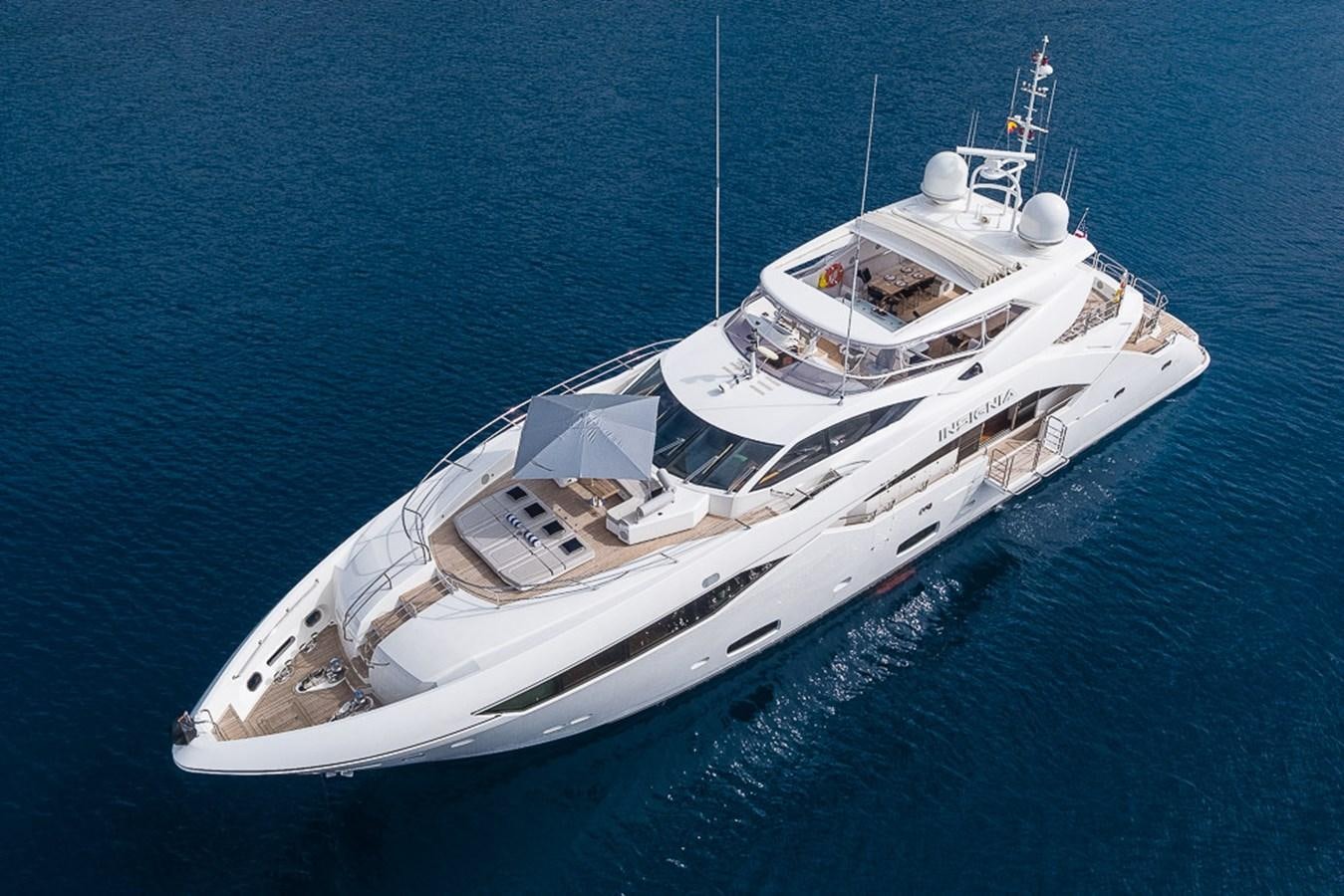 a white boat in the water aboard INSIGNIA Yacht for Sale
