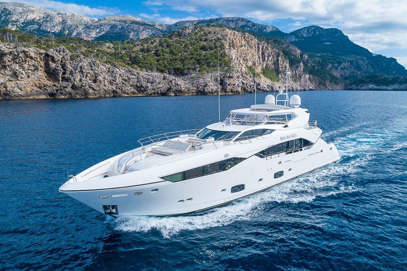 a white yacht on the water aboard INSIGNIA Yacht for Sale