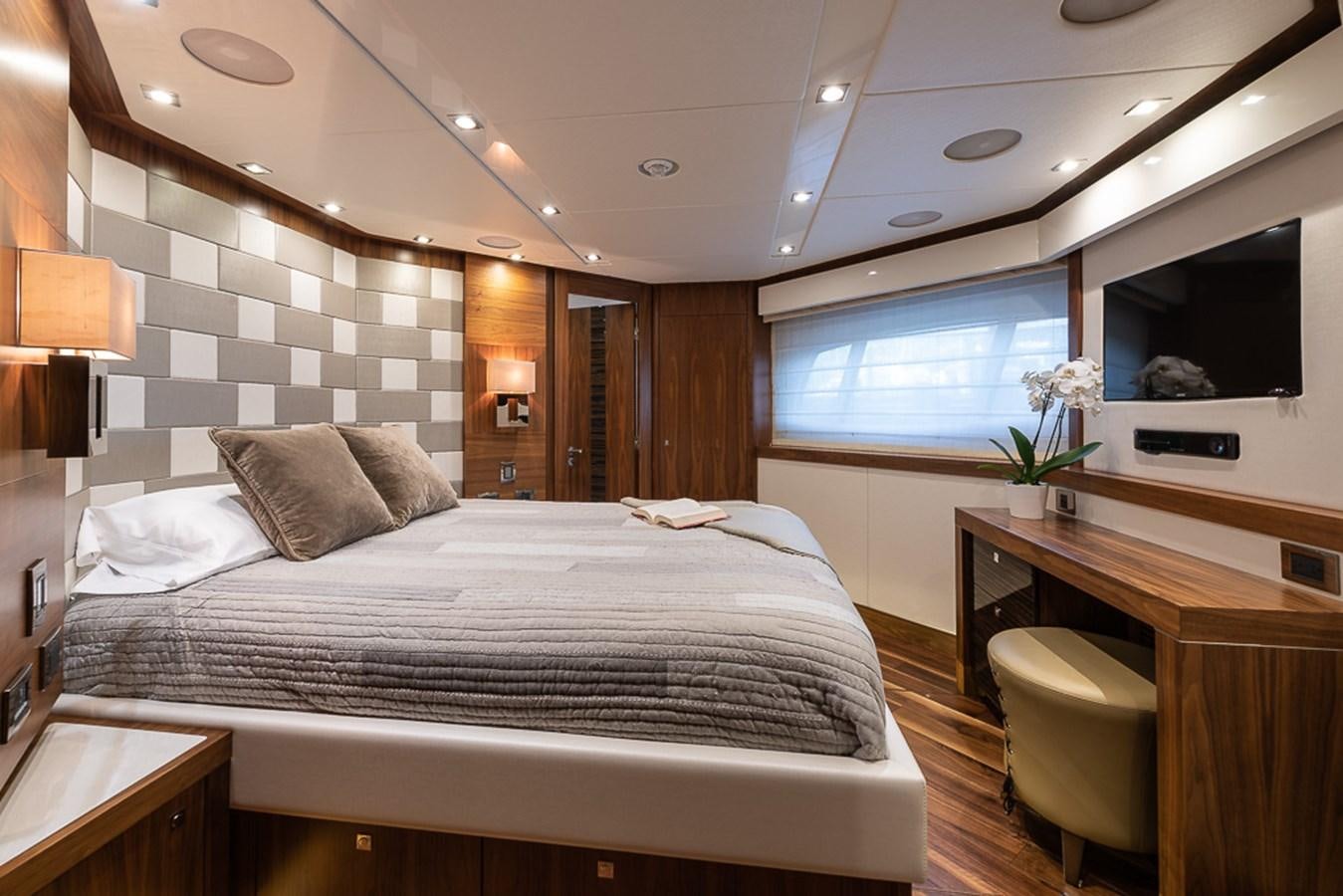 a large bedroom with a large bed aboard INSIGNIA Yacht for Sale