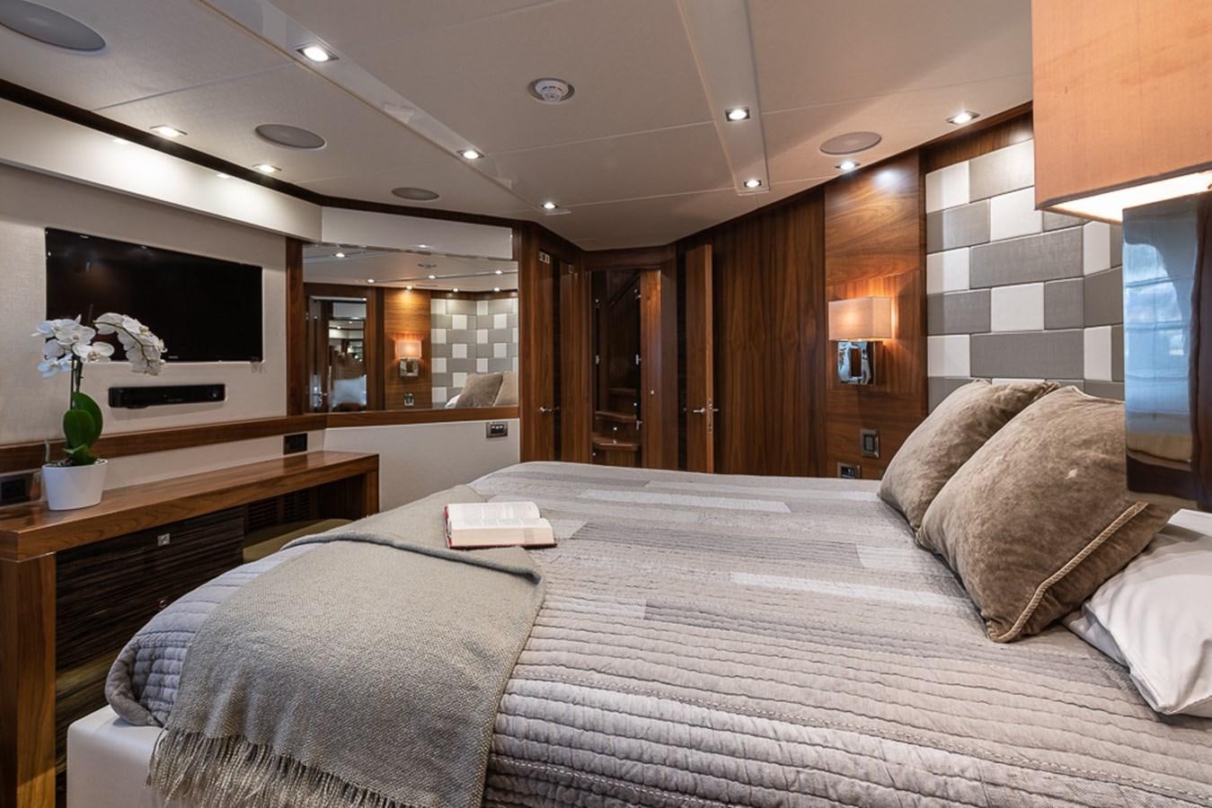 a large bed in a hotel room aboard INSIGNIA Yacht for Sale