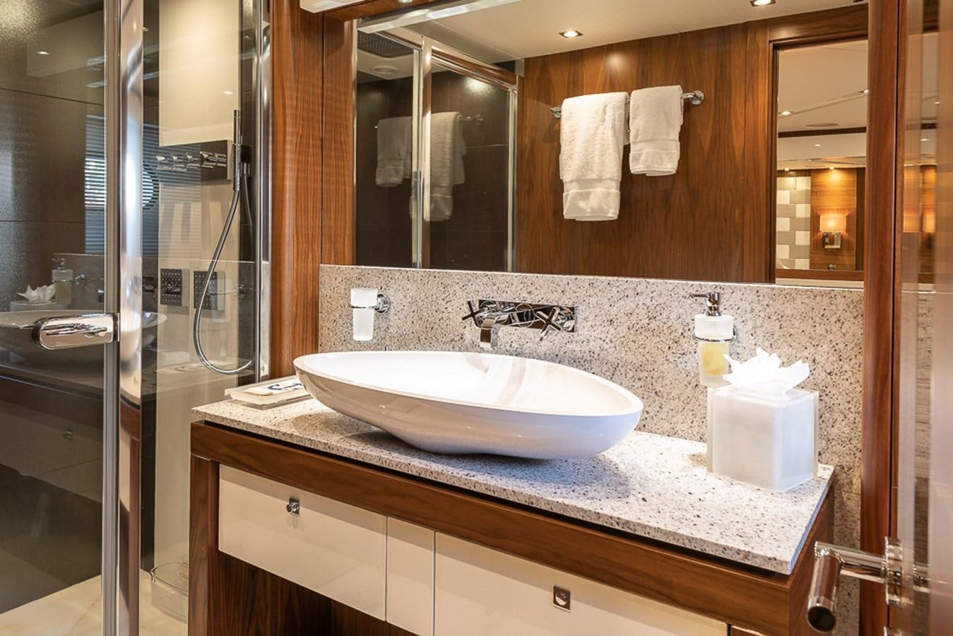a bathroom with a large mirror aboard INSIGNIA Yacht for Sale