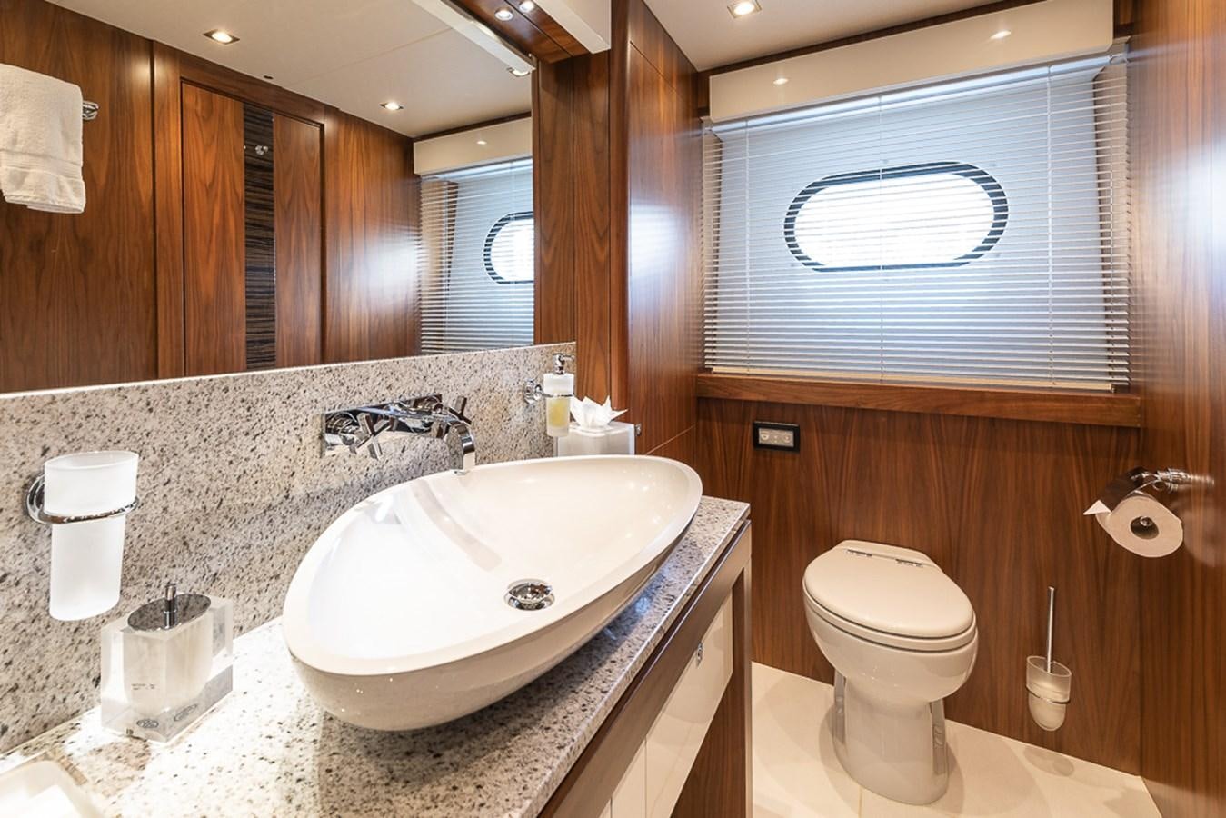 a bathroom with a sink and toilet aboard INSIGNIA Yacht for Sale