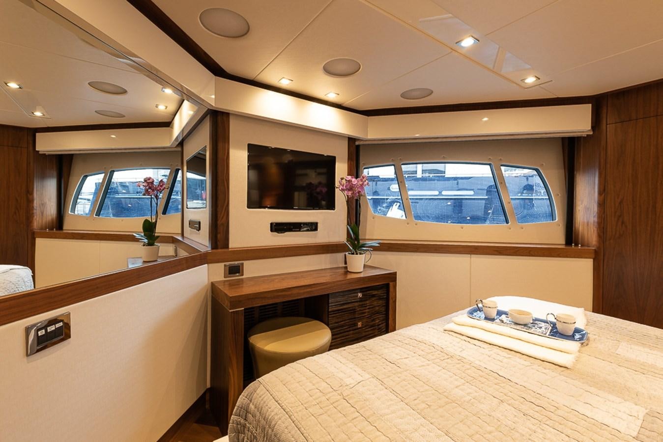 a room with a table and chairs aboard INSIGNIA Yacht for Sale