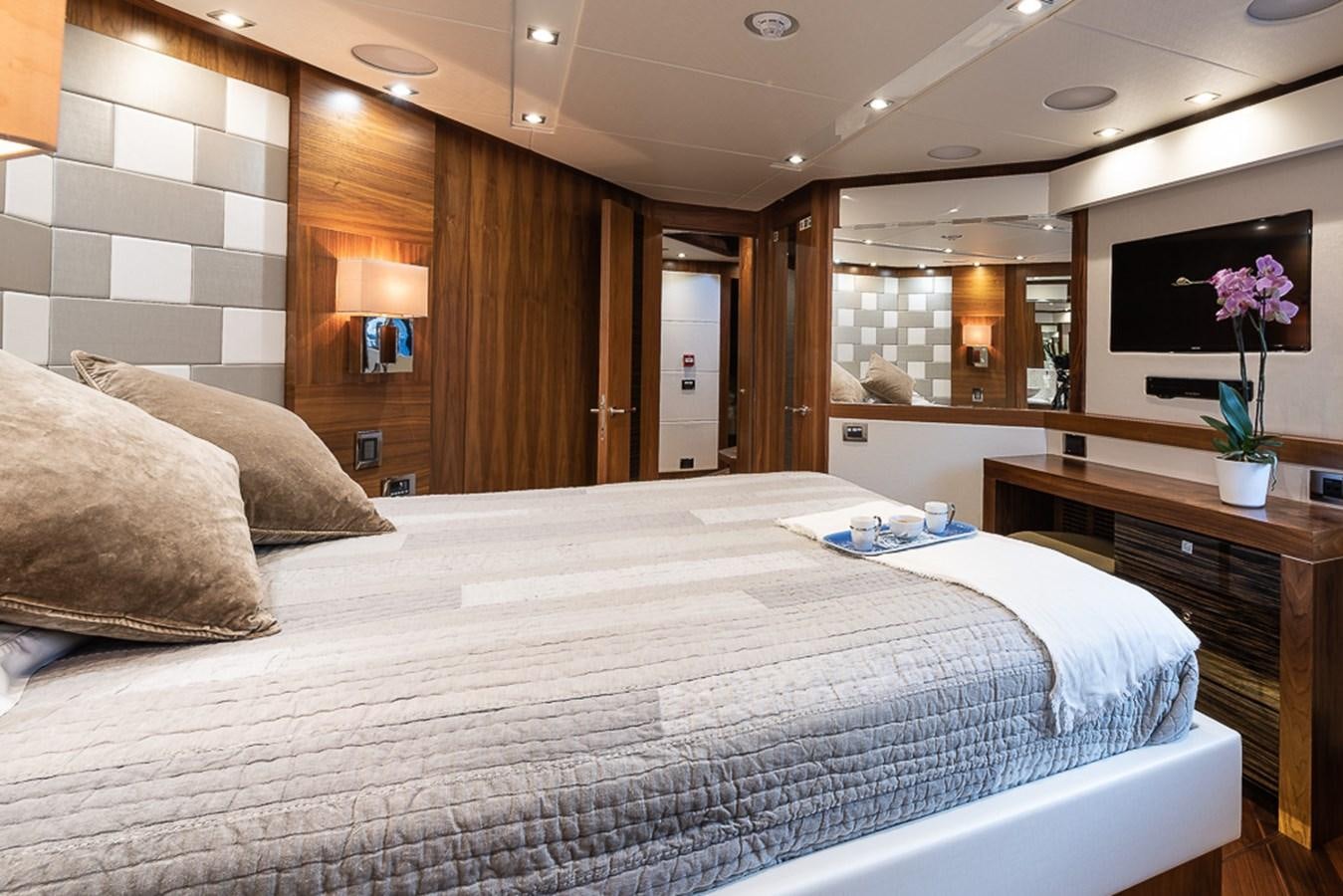 a large bed in a room aboard INSIGNIA Yacht for Sale