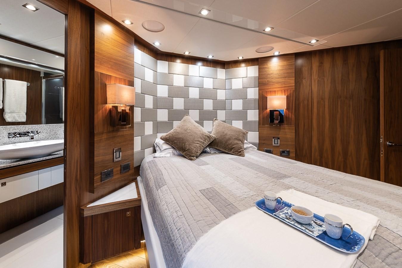 a bed in a room aboard INSIGNIA Yacht for Sale