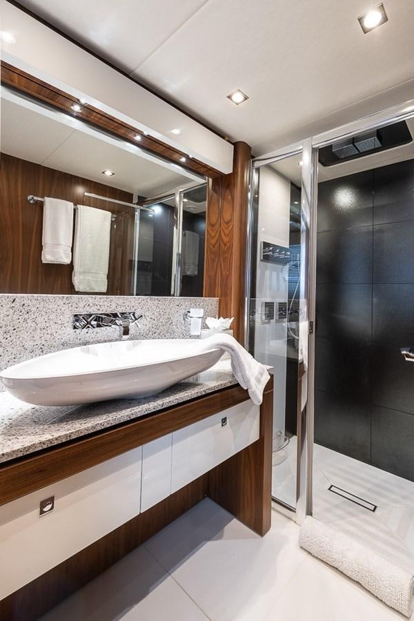 a bathroom with a large mirror aboard INSIGNIA Yacht for Sale