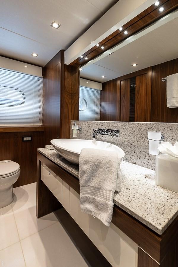 a bathroom with a large mirror aboard INSIGNIA Yacht for Sale
