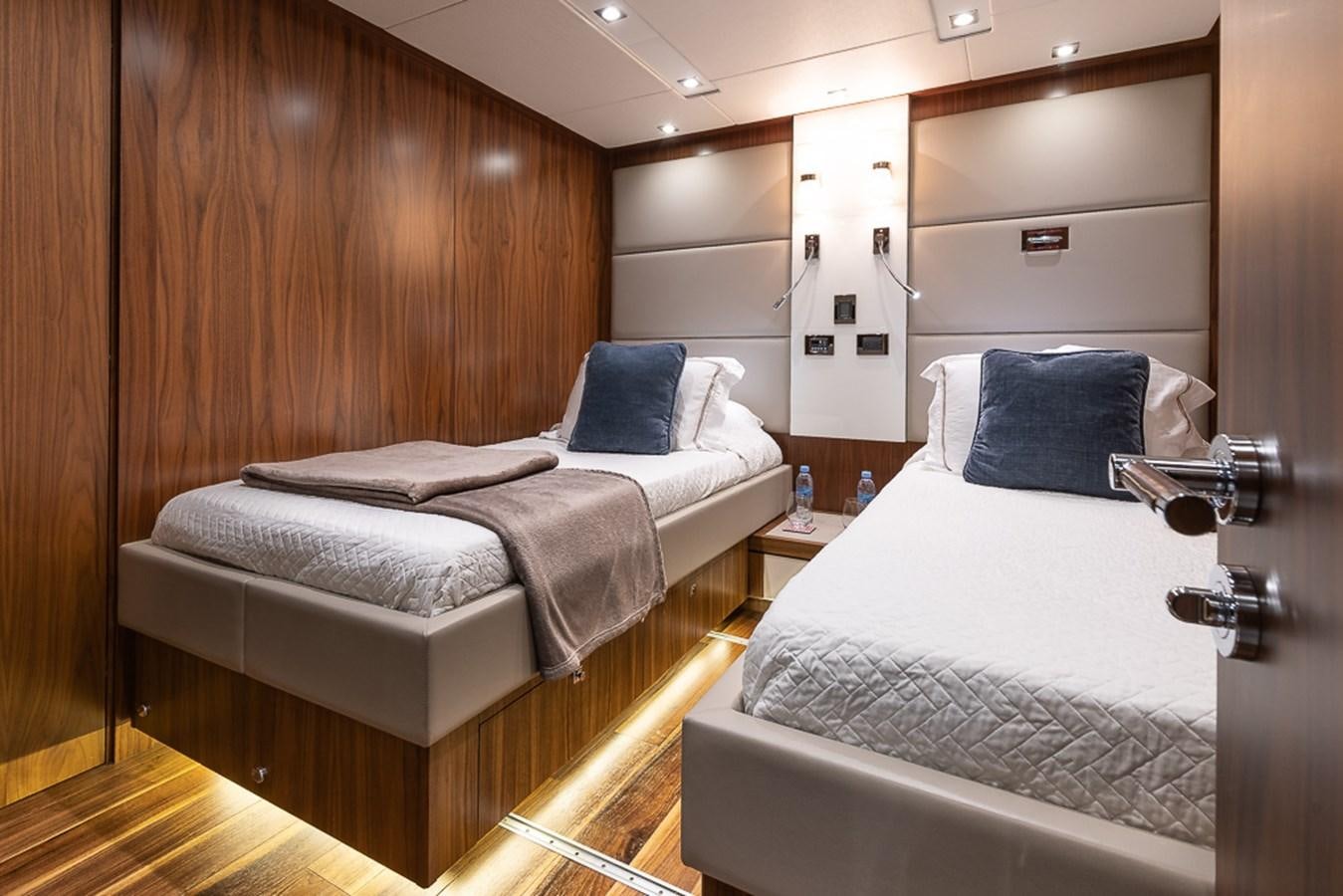 a room with two beds aboard INSIGNIA Yacht for Sale