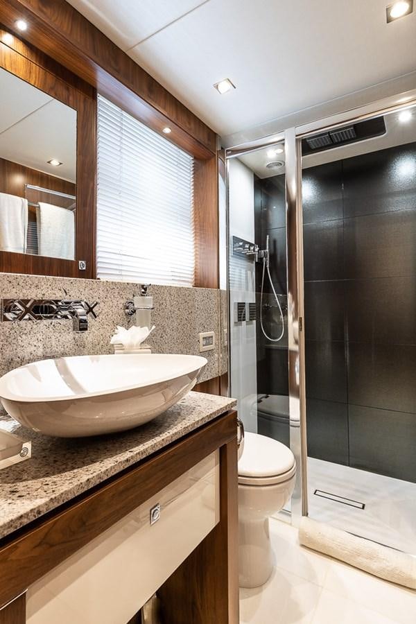 a bathroom with a sink and a toilet aboard INSIGNIA Yacht for Sale