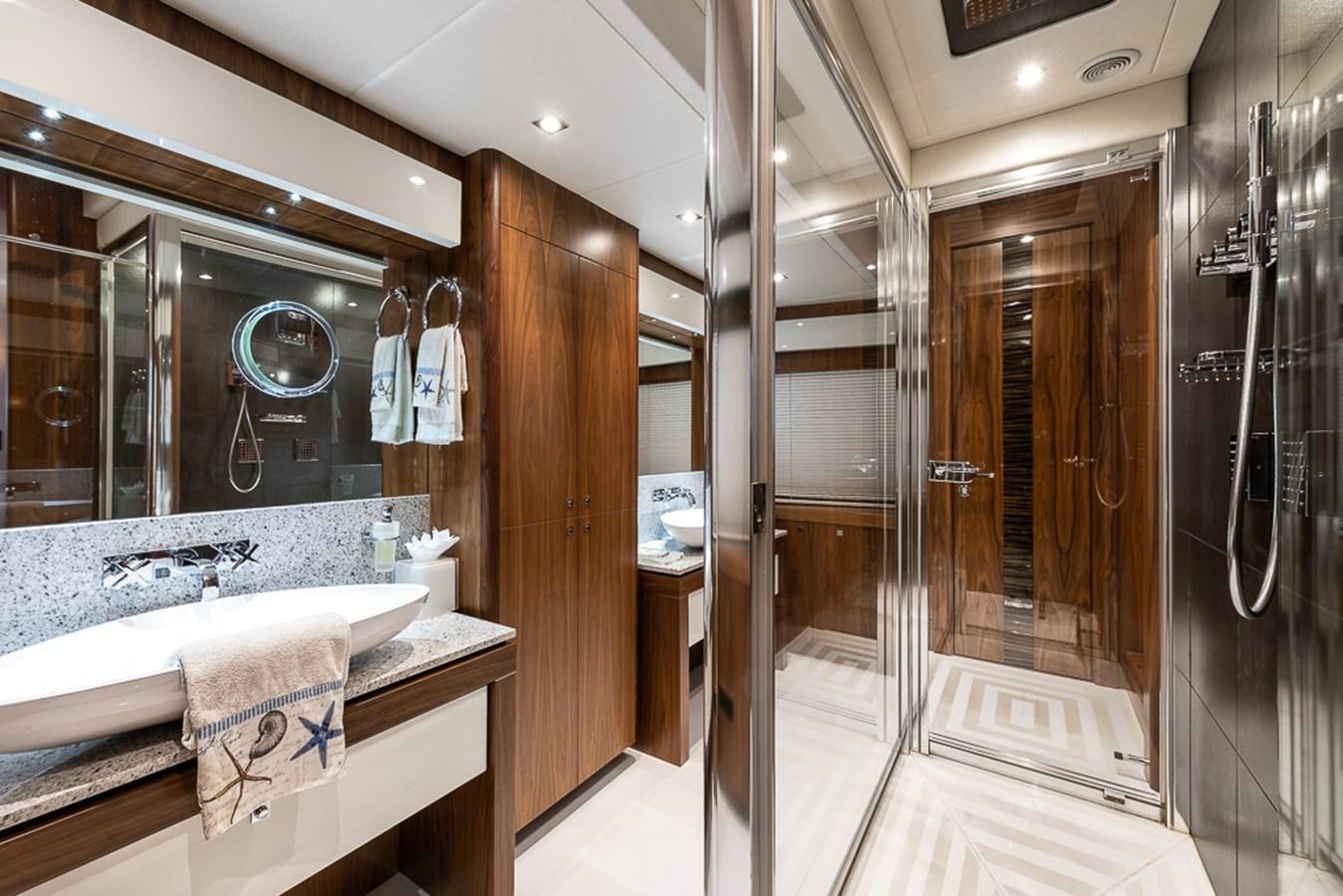 a bathroom with a large mirror aboard INSIGNIA Yacht for Sale