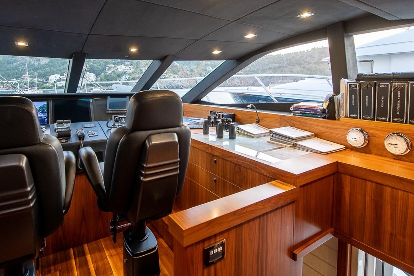 a desk with a chair and a computer on it aboard INSIGNIA Yacht for Sale