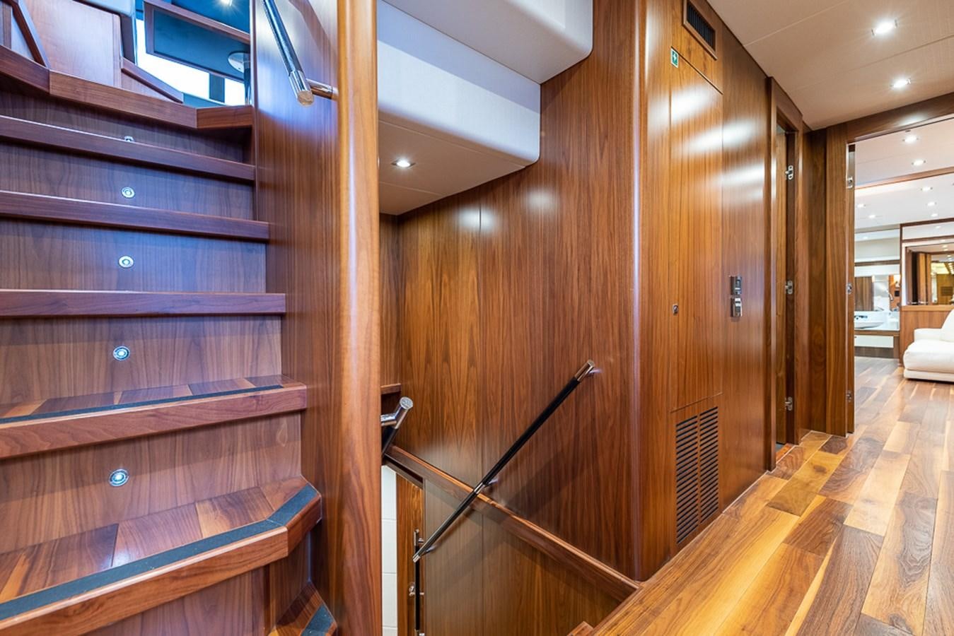 a wood wall with a wood railing aboard INSIGNIA Yacht for Sale